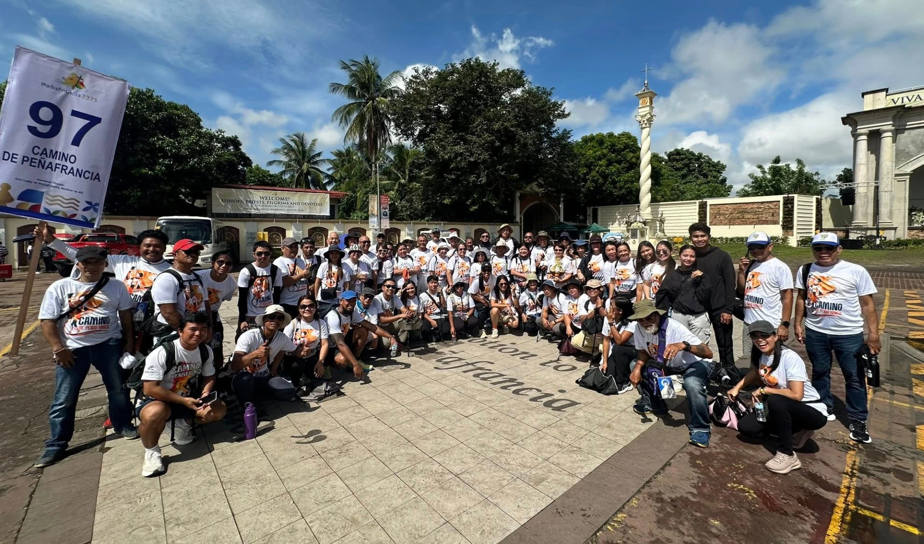Group of pilgrims standing outside the Peñafrancia Shrine.